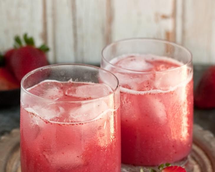 A Delectable Cocktail With Strawberries And Coconut Water