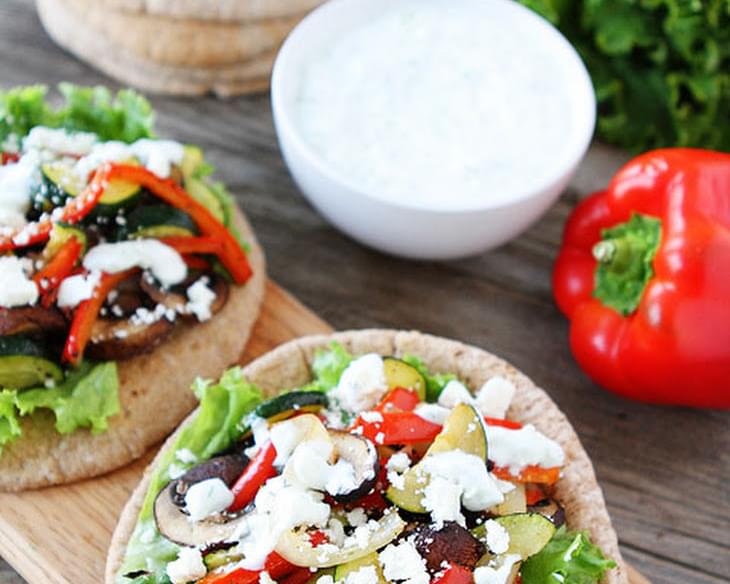 Healthy Pita Sandwich With Roasted Vegetables, Feta Cheese, And Tzatziki Sauce