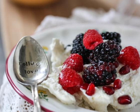 Vanilla Bean Pavlova with Honey Cream and Berries