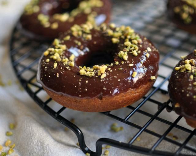 Baked Pumpkin Donuts with Chocolate Glaze and Chopped Pistachios