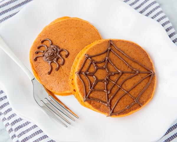 Pumpkin Pancakes with Chocolate Spiderwebs