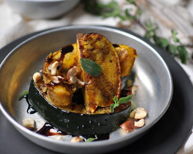 Roasted Acorn Squash with Hazelnuts and Balsamic Reduction