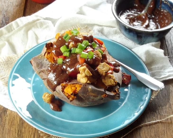 Ginger Tempeh Stuffed Sweet Potatoes with Almond Butter Sauce