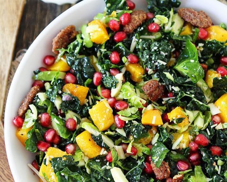 Kale and Brussels Sprouts Salad with Butternut Squash, Pomegranate, and Candied Pecans