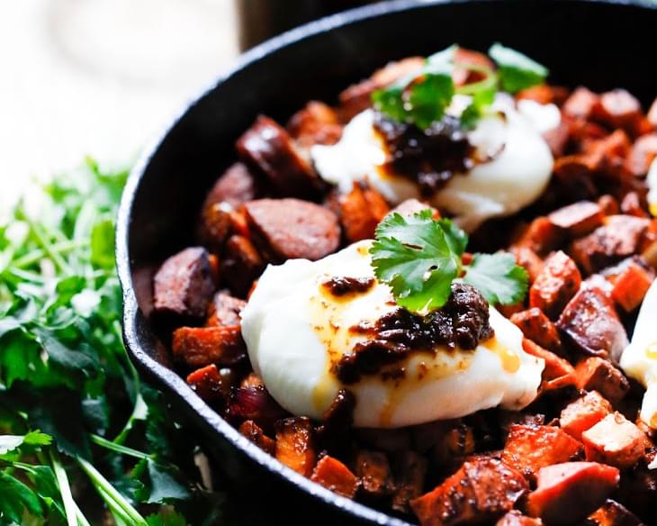 Harissa Sweet Potato Hash with Poached Eggs and Merguez Sausage