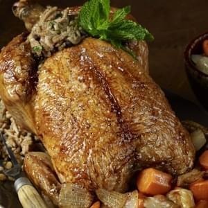 Middle Eastern Roasted Chicken with Rice, Currant, and Pine Nut Stuffing