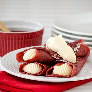 Red Velvet Crepes with Cheesecake Mousse and Raspberry Sauce