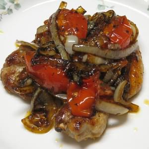 Pan Fried Pork Chops with Balsamic Glazed Tomato and Onion Sautee