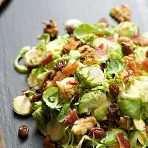 Shaved Brussels Sprout Salad with Raisins & Maple Dijon Vinaigrette