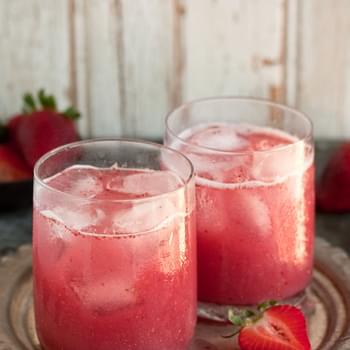 A Delectable Cocktail With Strawberries And Coconut Water