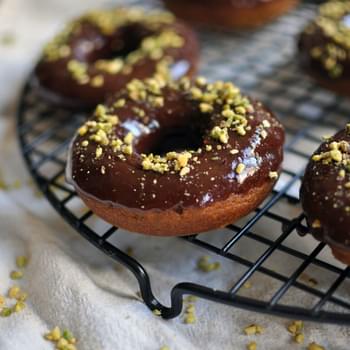 Baked Pumpkin Donuts with Chocolate Glaze and Chopped Pistachios