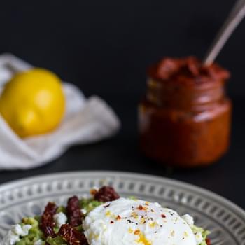 Harissa, Smashed Avocado + Egg Toast with Goat Cheese and Honey Drizzle.