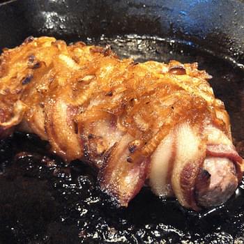 Bacon Wrapped Pork Tenderloin Topped With Candied Onions