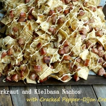 Sauerkraut and Kielbasa Nachos with Cracked Pepper-Dijon Cream