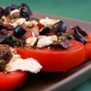 Sliced Tomato, Olive, and Goat Cheese Salad with Onion-Caper Vinaigrette