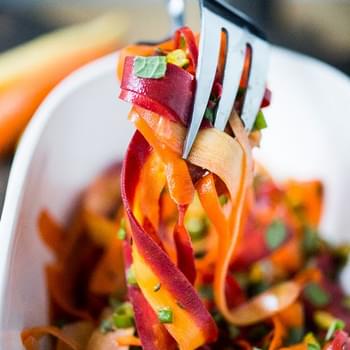A Moroccan inspired salad with shaved carrots, pistachio, mint and pomegranate vinaigrette