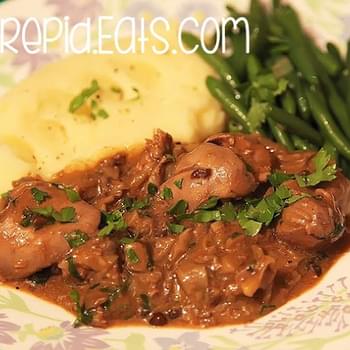 Sauteed Chicken Livers With Onions, Served With Beans And Mash Potatoes.